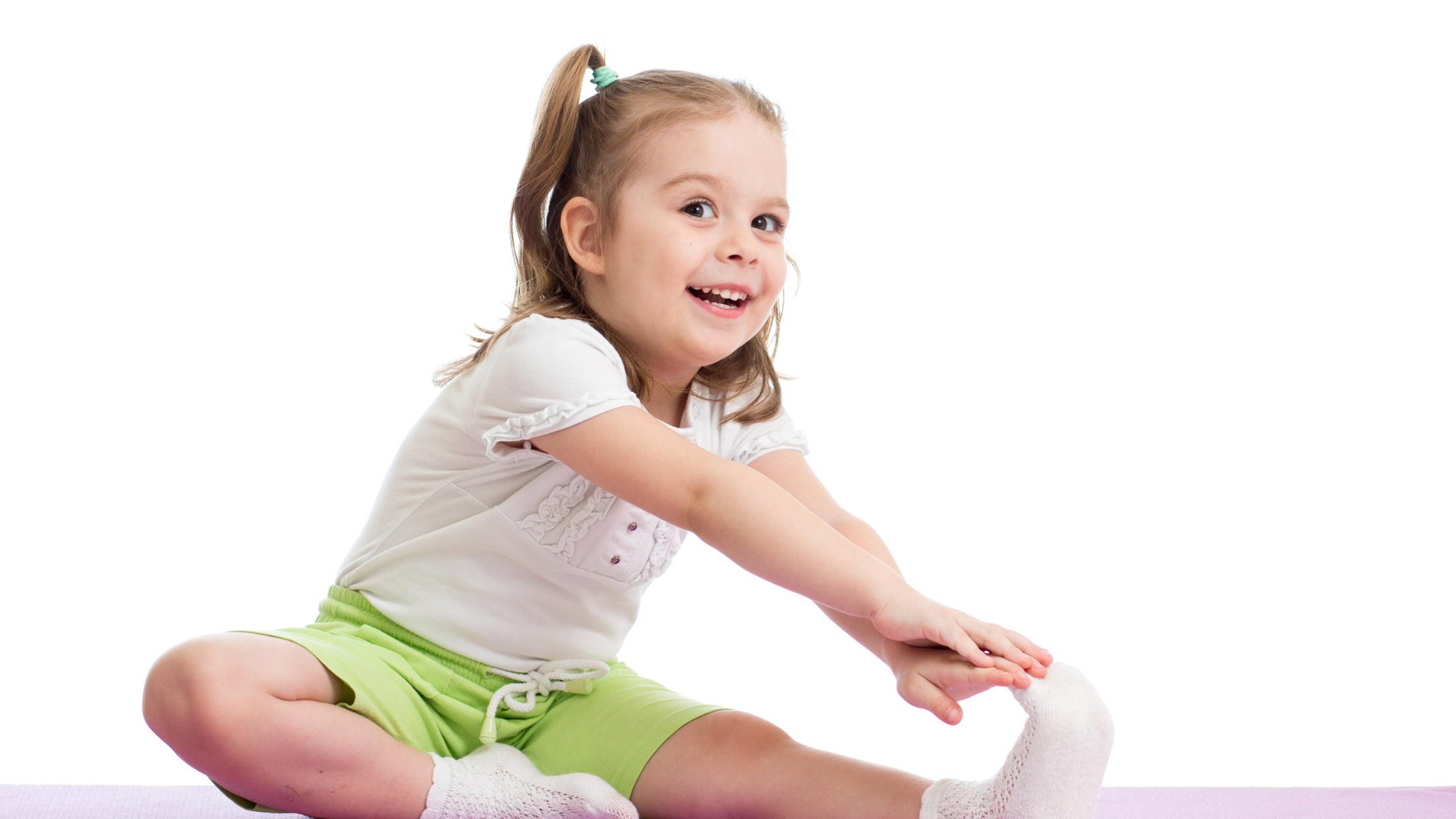 small young girl stretching and touching her toes
