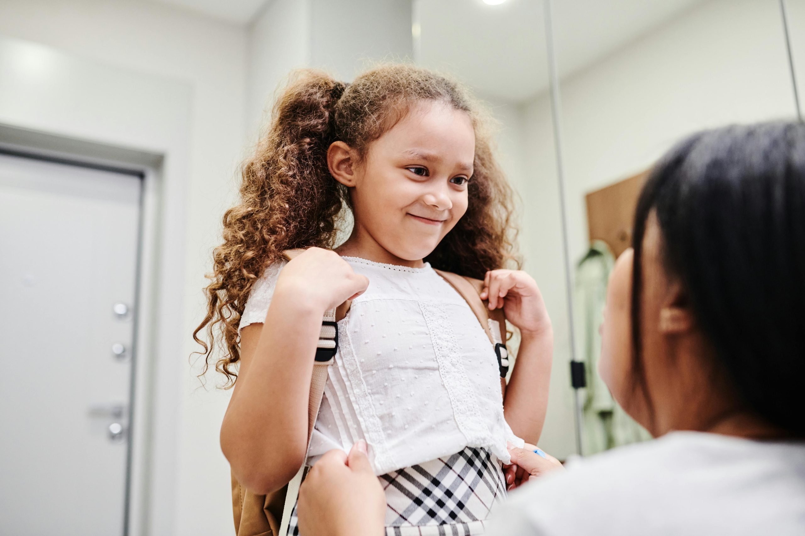 little girl looking a little anxious and excited about going to school